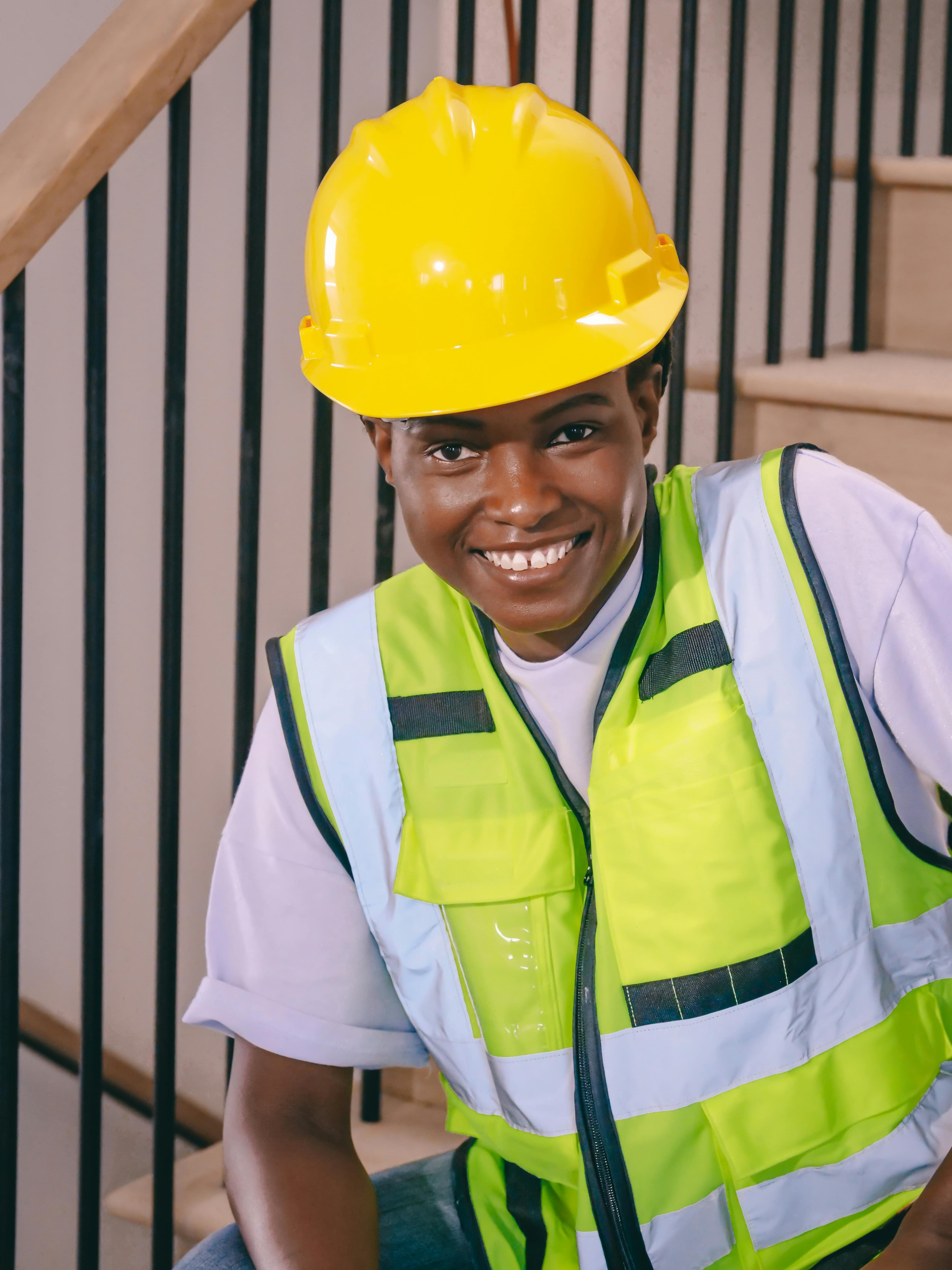 Happy construction worker smiling on site